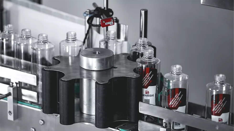 Labeller applying labels to bottles