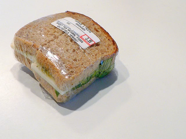 Cheese and bakery items wrapped in cling film
